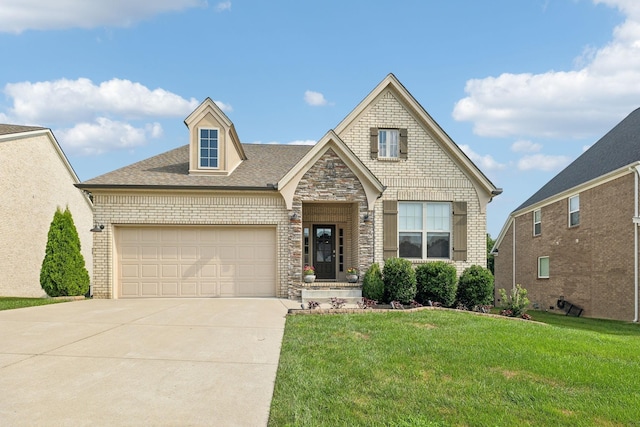 view of front of house with driveway, stone siding, an attached garage, a front lawn, and brick siding