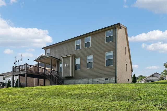 back of house featuring a yard, crawl space, stairway, and a wooden deck