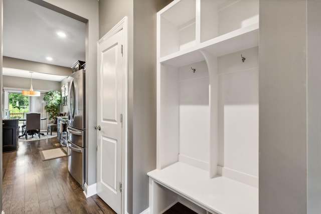 mudroom featuring dark wood finished floors and recessed lighting