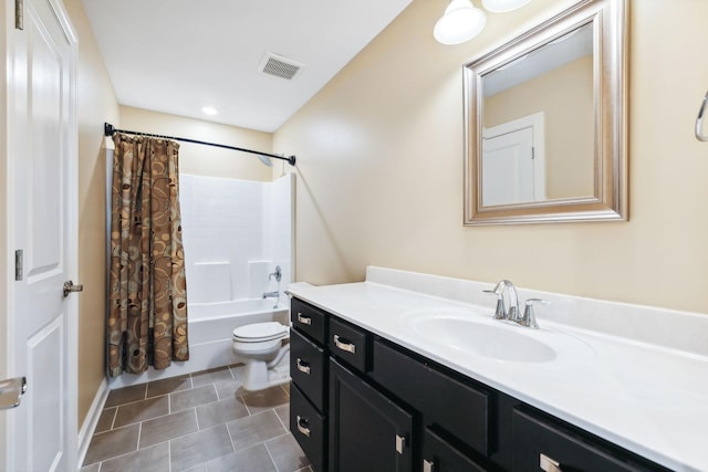 full bathroom with tile patterned floors, vanity, toilet, and shower / tub combo