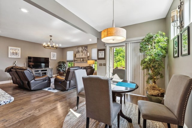 dining room featuring baseboards, a chandelier, wood finished floors, and recessed lighting