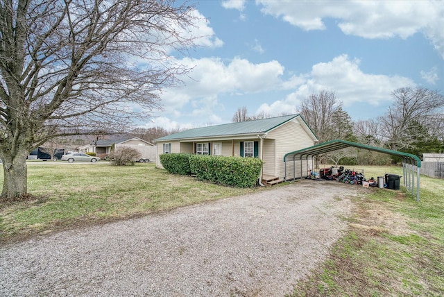 view of home's exterior with a yard and a carport