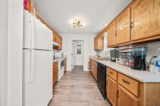 kitchen with sink, a textured ceiling, white appliances, and light hardwood / wood-style floors