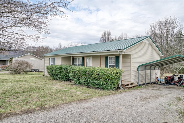 view of home's exterior featuring a yard and a carport