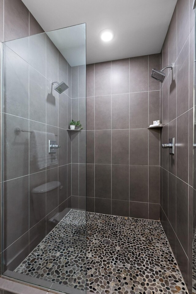 bathroom with tiled shower