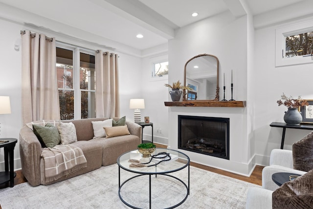 living room featuring hardwood / wood-style flooring and beamed ceiling