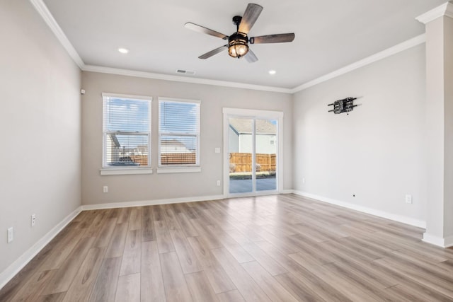 spare room featuring ornamental molding, light hardwood / wood-style floors, and ceiling fan