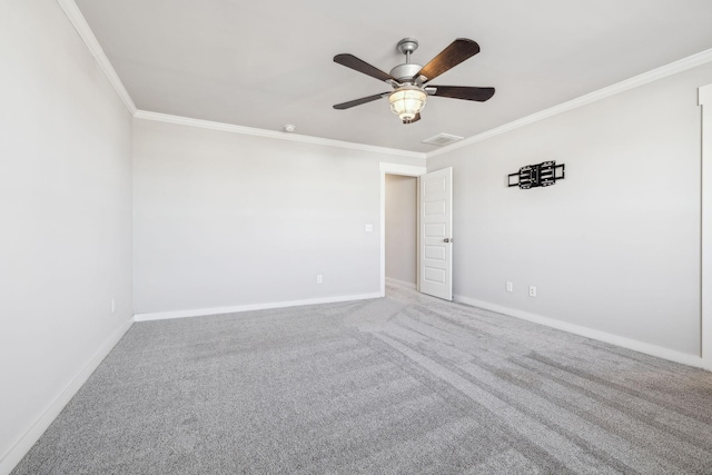 empty room featuring ornamental molding, carpet flooring, and ceiling fan