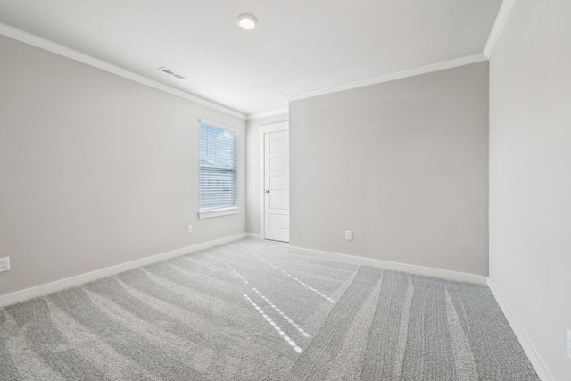 carpeted spare room with ornamental molding