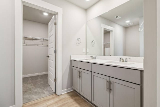 bathroom with vanity and hardwood / wood-style floors