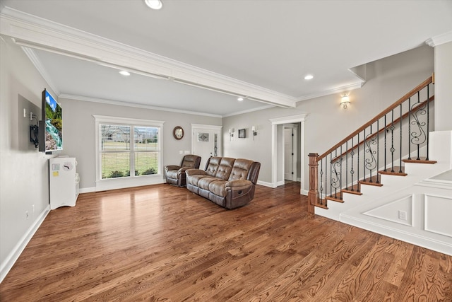 living room featuring hardwood / wood-style floors and crown molding