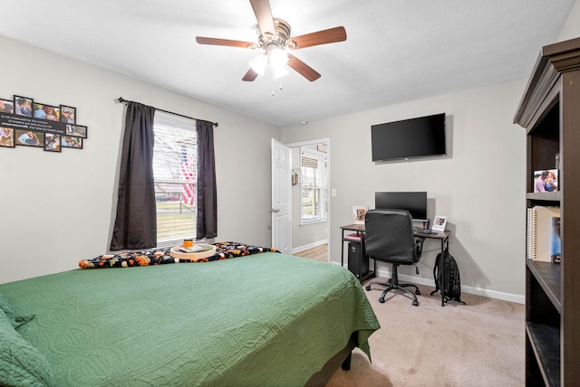 carpeted bedroom featuring ceiling fan