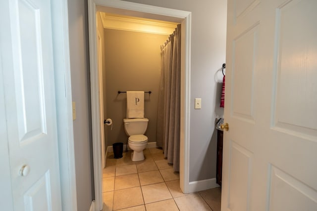 bathroom with tile patterned flooring and toilet