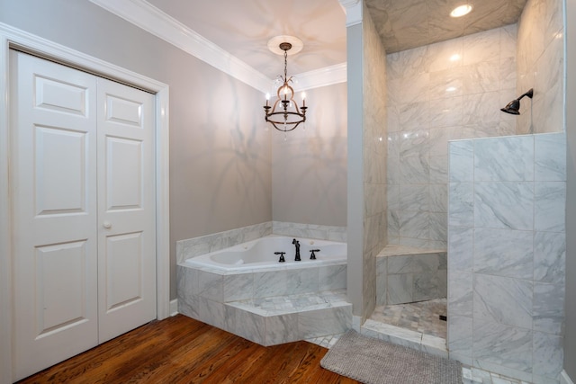 bathroom with a notable chandelier, crown molding, shower with separate bathtub, and hardwood / wood-style flooring