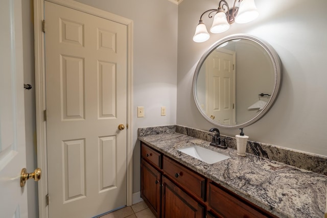 bathroom with tile patterned flooring and vanity