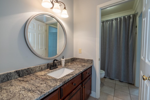 bathroom featuring tile patterned floors, toilet, and vanity