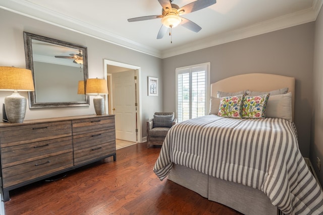 bedroom with ceiling fan, ornamental molding, and dark hardwood / wood-style flooring