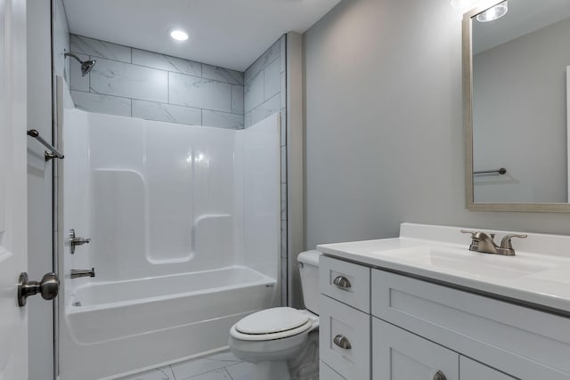 full bathroom with toilet, marble finish floor, shower / bath combination, and vanity