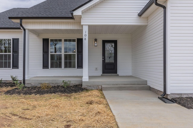 property entrance featuring covered porch