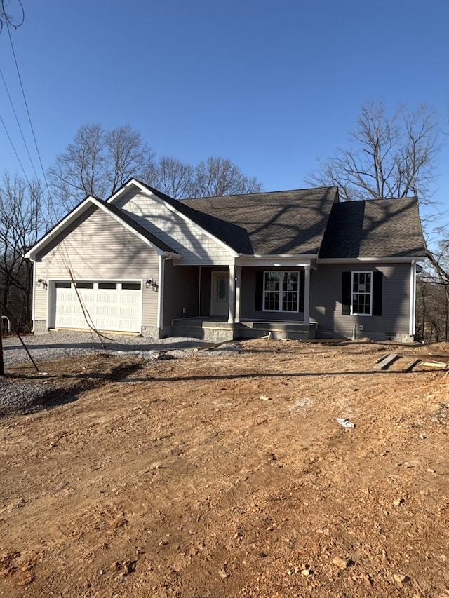 ranch-style house featuring driveway and an attached garage