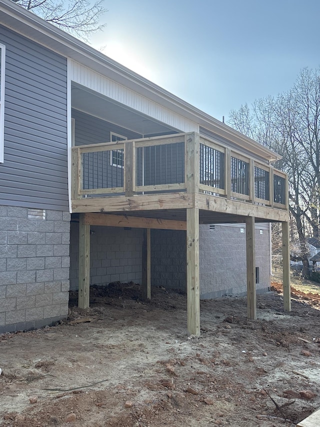 back of house with a wooden deck