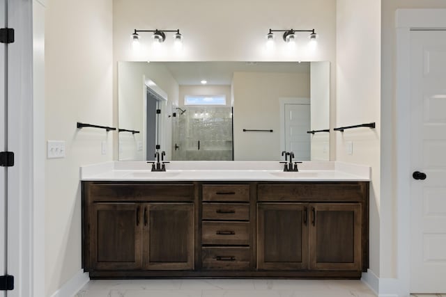 bathroom featuring a shower with door and vanity