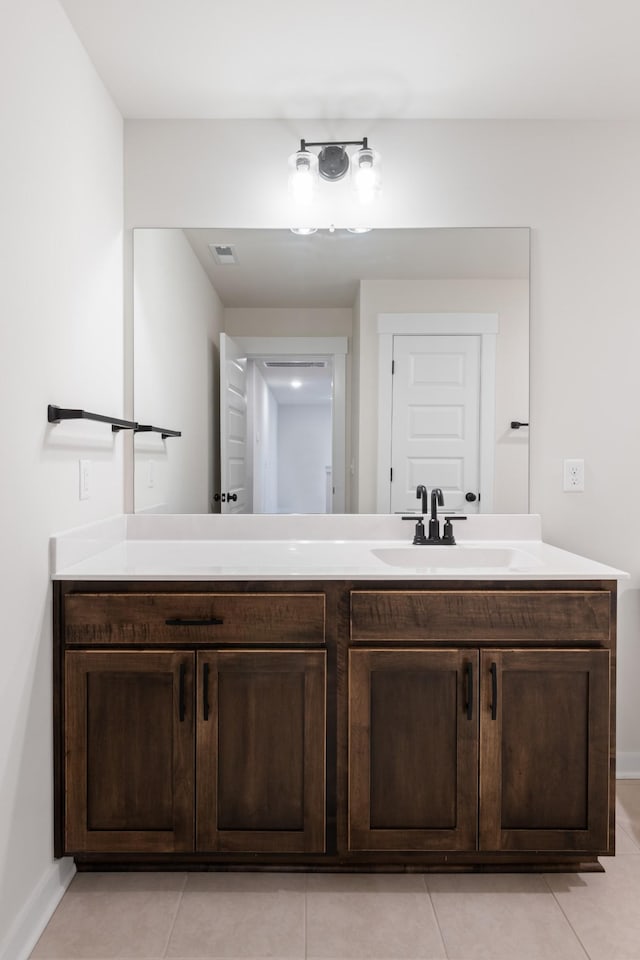 bathroom with vanity and tile patterned flooring