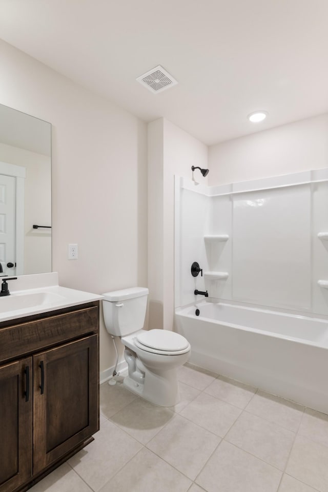 full bathroom with bathtub / shower combination, toilet, vanity, and tile patterned floors