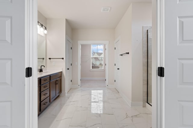 bathroom with vanity and walk in shower