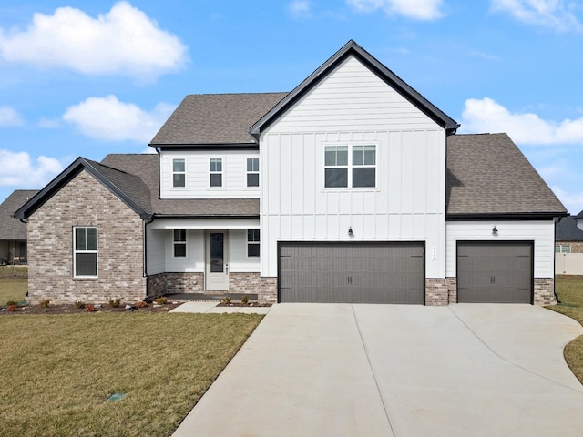 view of front of house featuring a front yard and a garage