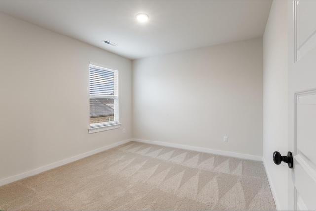 unfurnished room with light carpet