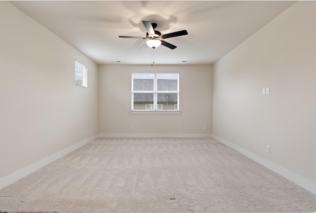 unfurnished room featuring ceiling fan and light carpet