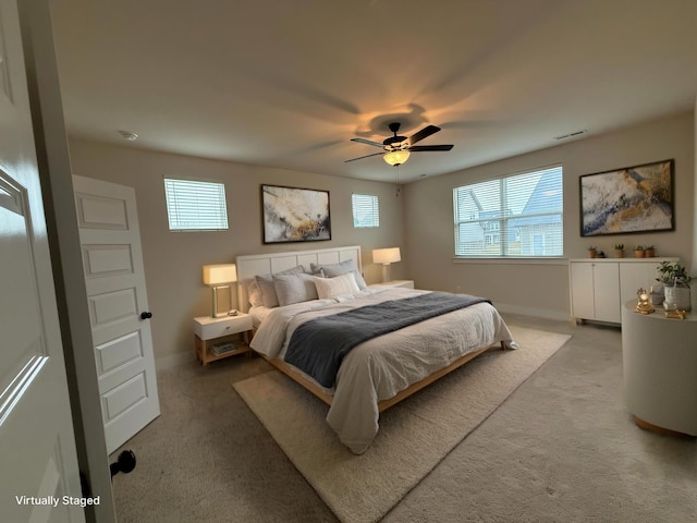 bedroom with ceiling fan and carpet