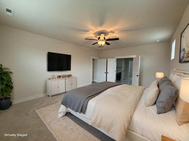 bedroom with light colored carpet and ceiling fan