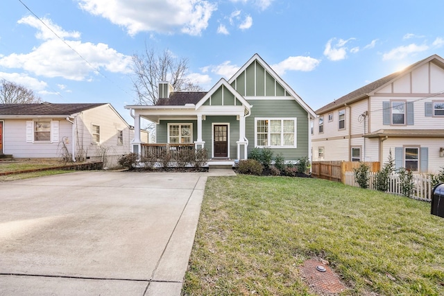 view of front of house featuring a front yard and a porch