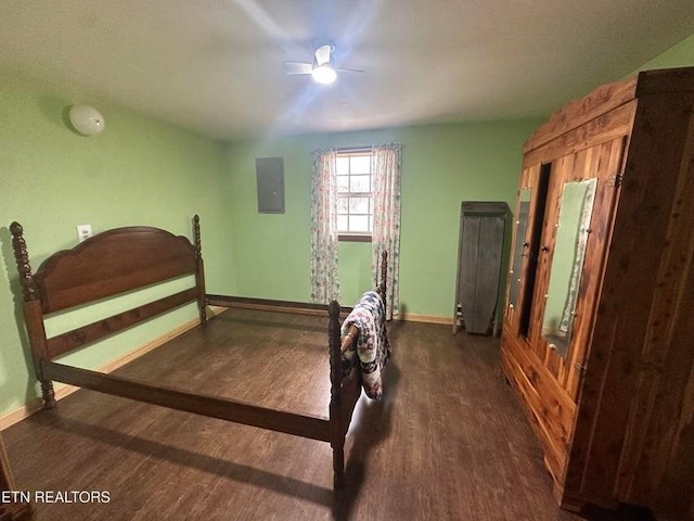 bedroom featuring dark wood-type flooring, electric panel, and ceiling fan