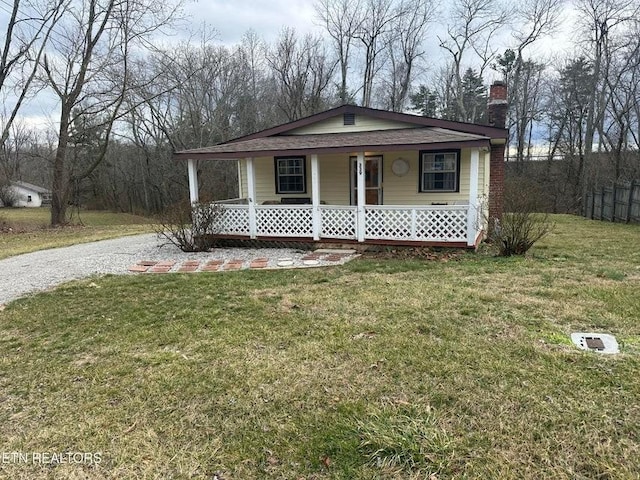 view of front of house featuring a front lawn and covered porch