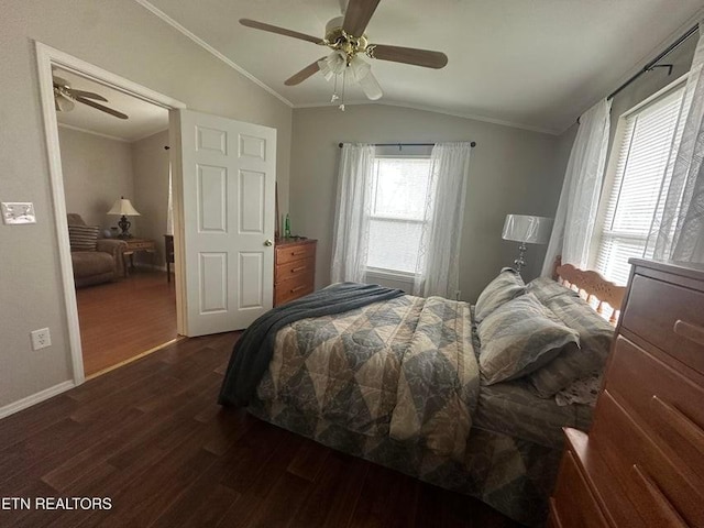 bedroom with vaulted ceiling, ornamental molding, ceiling fan, and dark hardwood / wood-style flooring