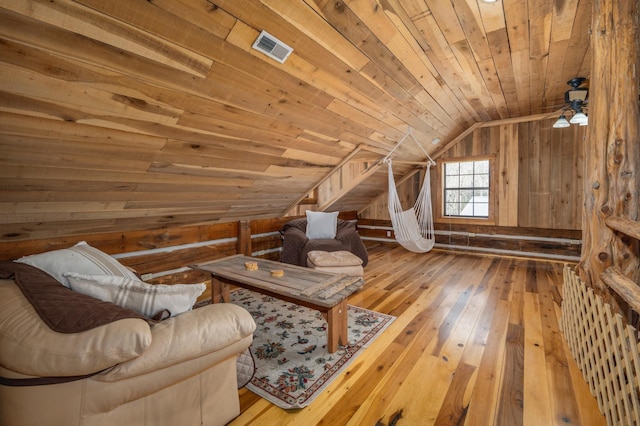 unfurnished room with lofted ceiling, hardwood / wood-style floors, wood ceiling, and wooden walls