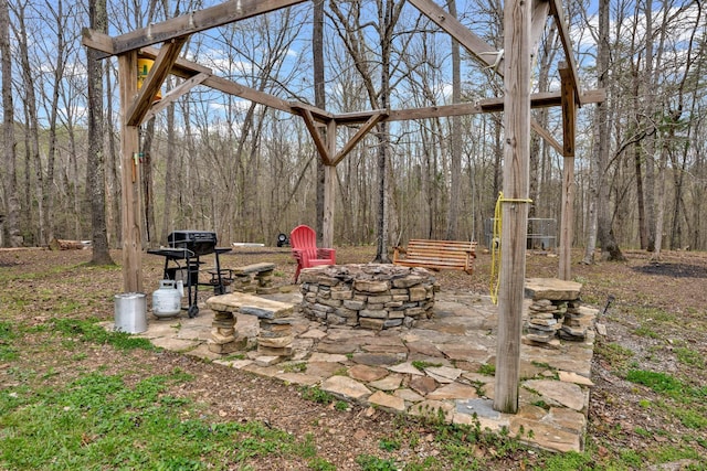 view of patio with a fire pit