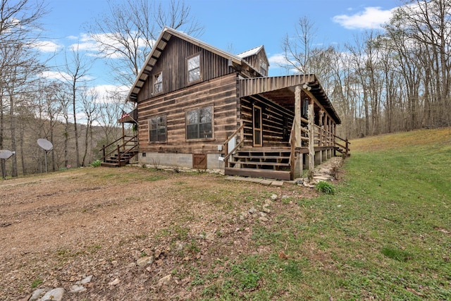 view of property exterior with a yard