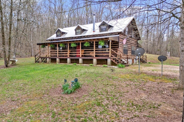 cabin with a front lawn