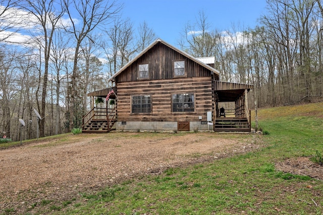 view of property exterior featuring a lawn