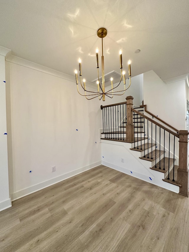 unfurnished dining area with ornamental molding and hardwood / wood-style floors