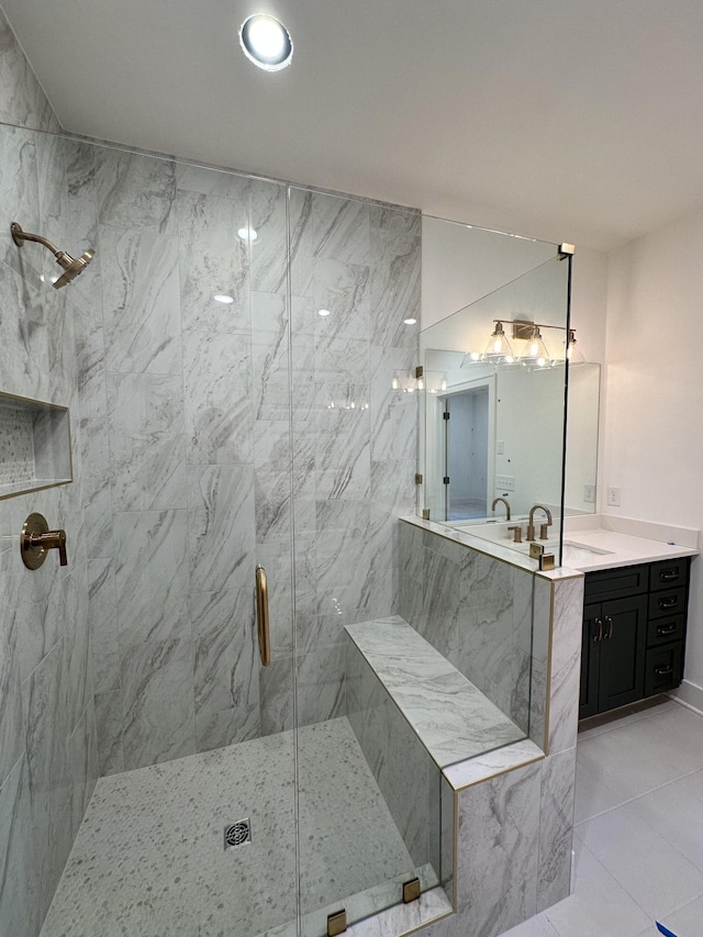 bathroom featuring vanity and a shower with shower door