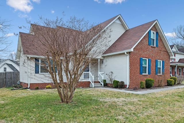 view of front of property with a porch and a front yard