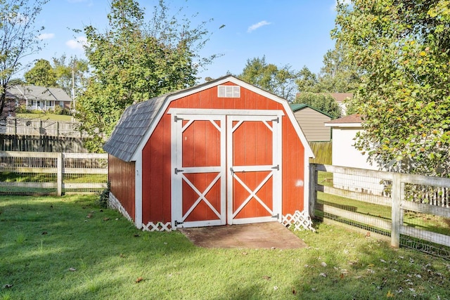 view of outbuilding with a lawn