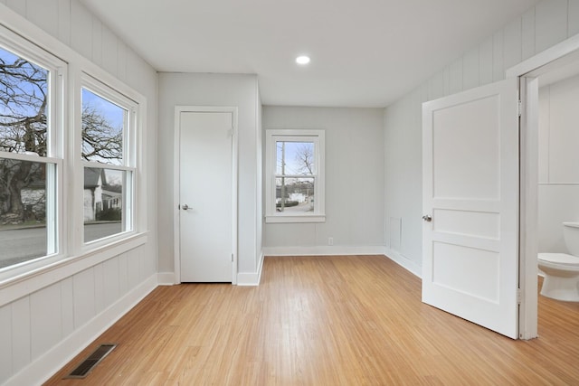 unfurnished bedroom featuring light wood-type flooring