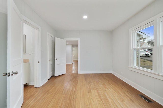 unfurnished room featuring light hardwood / wood-style flooring