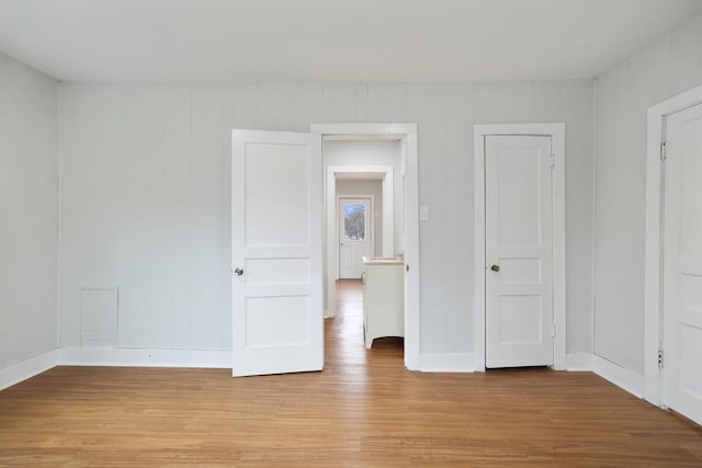 spare room featuring light wood-type flooring